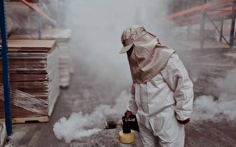 Exterminator performing a commercial fumigation